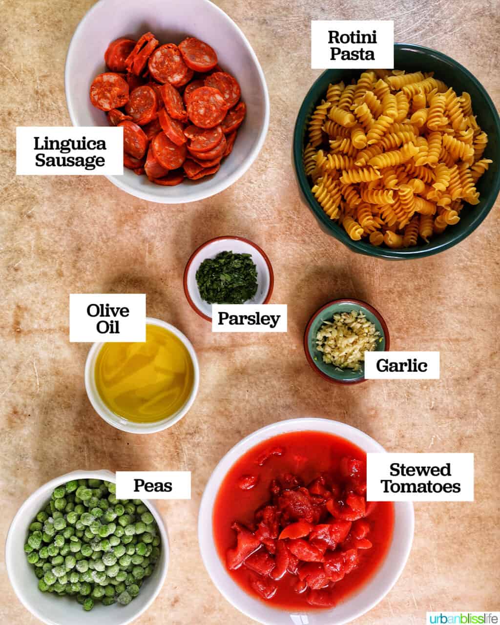 bowls filled with ingredients to make linguica pasta.