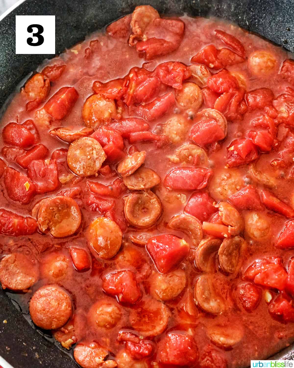 tomatoes cooking in a skillet.