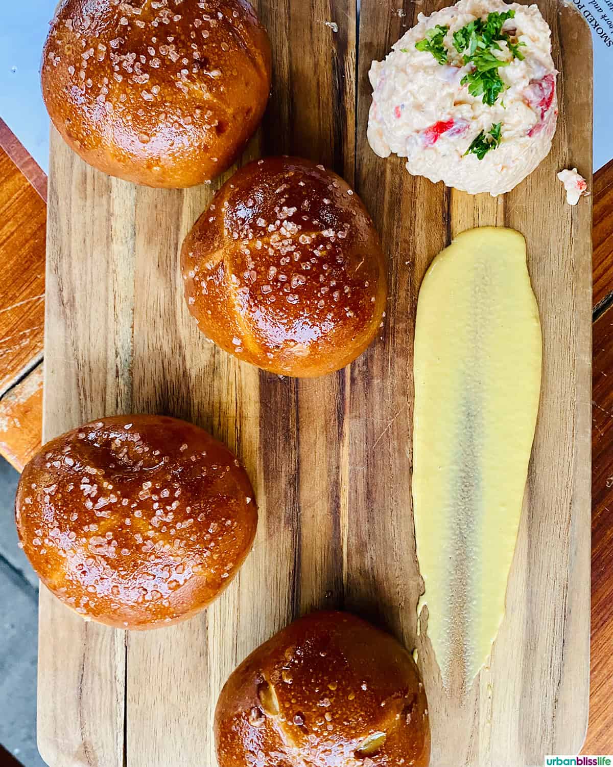 pretzels on a wooden board at Bible Club PDX .
