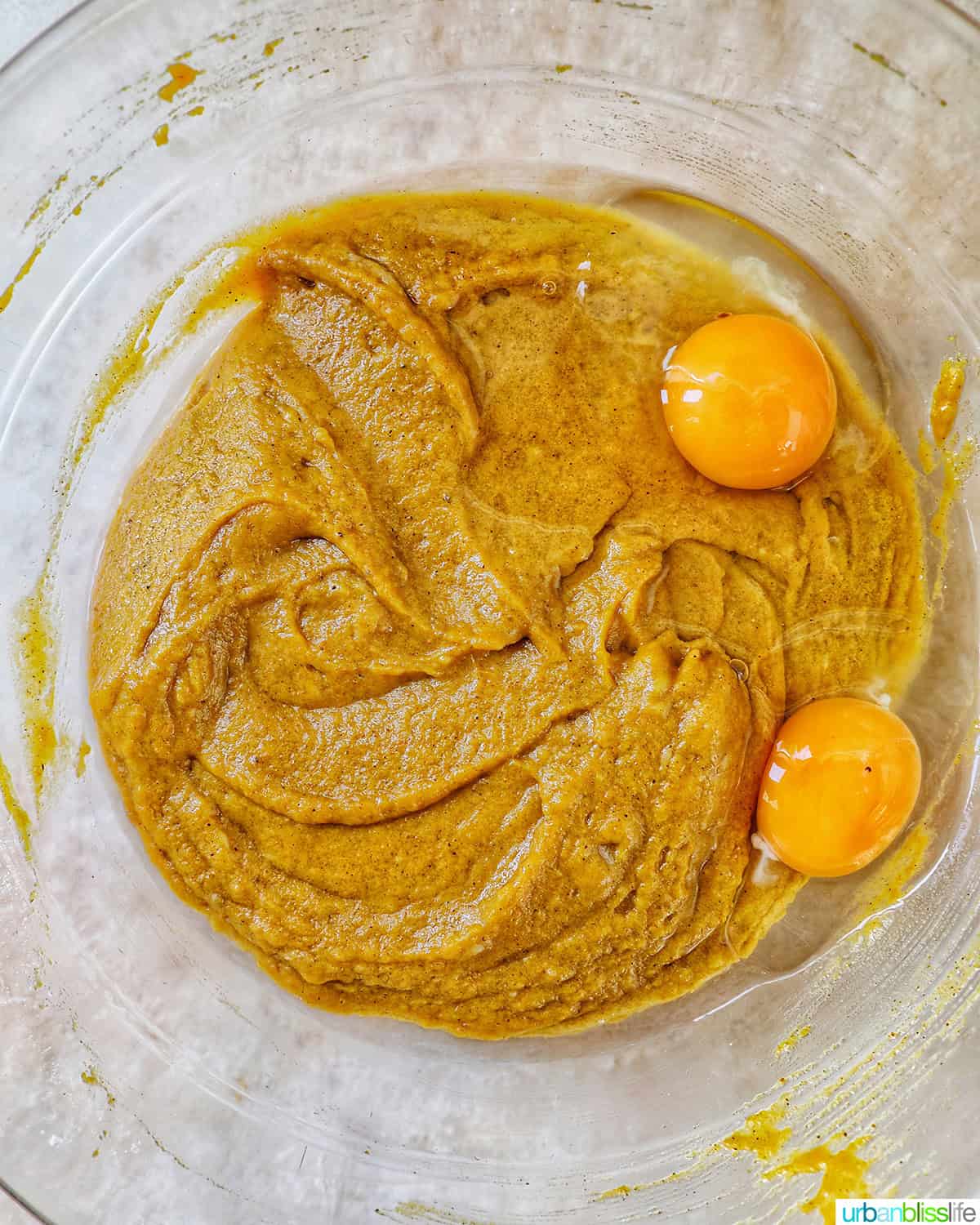eggs added to chocolate chip pumpkin bread batter.