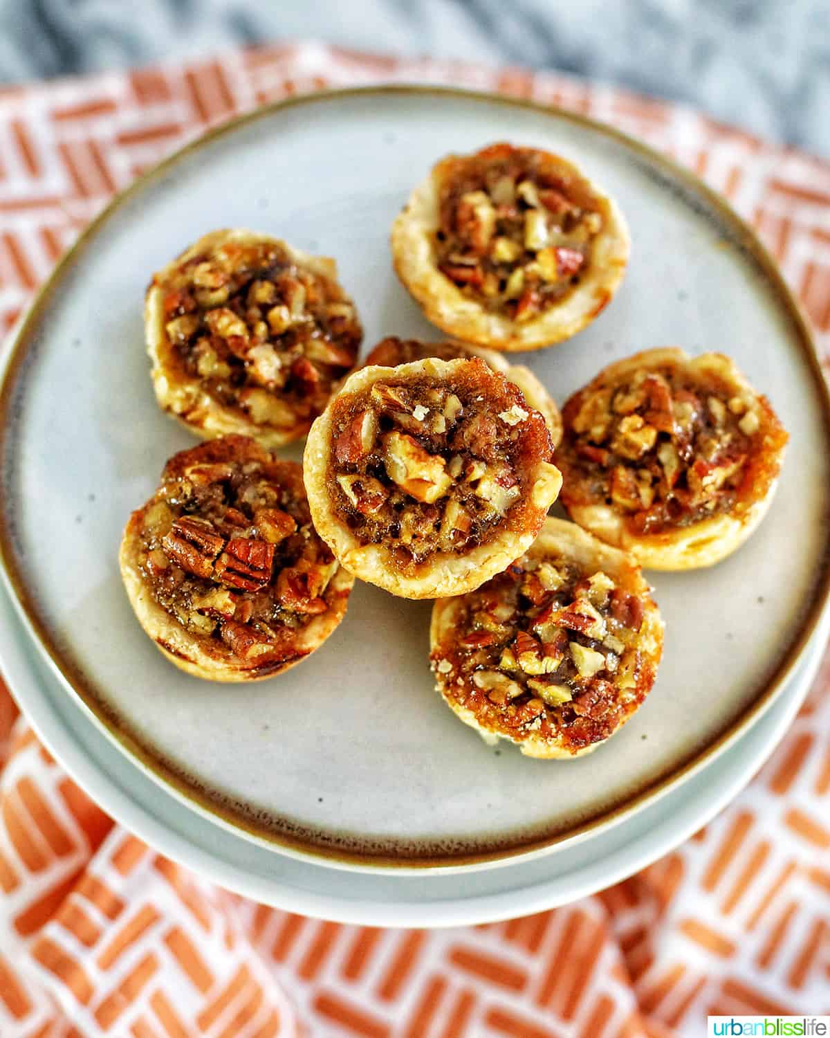 mini pecan pies centered on a plate