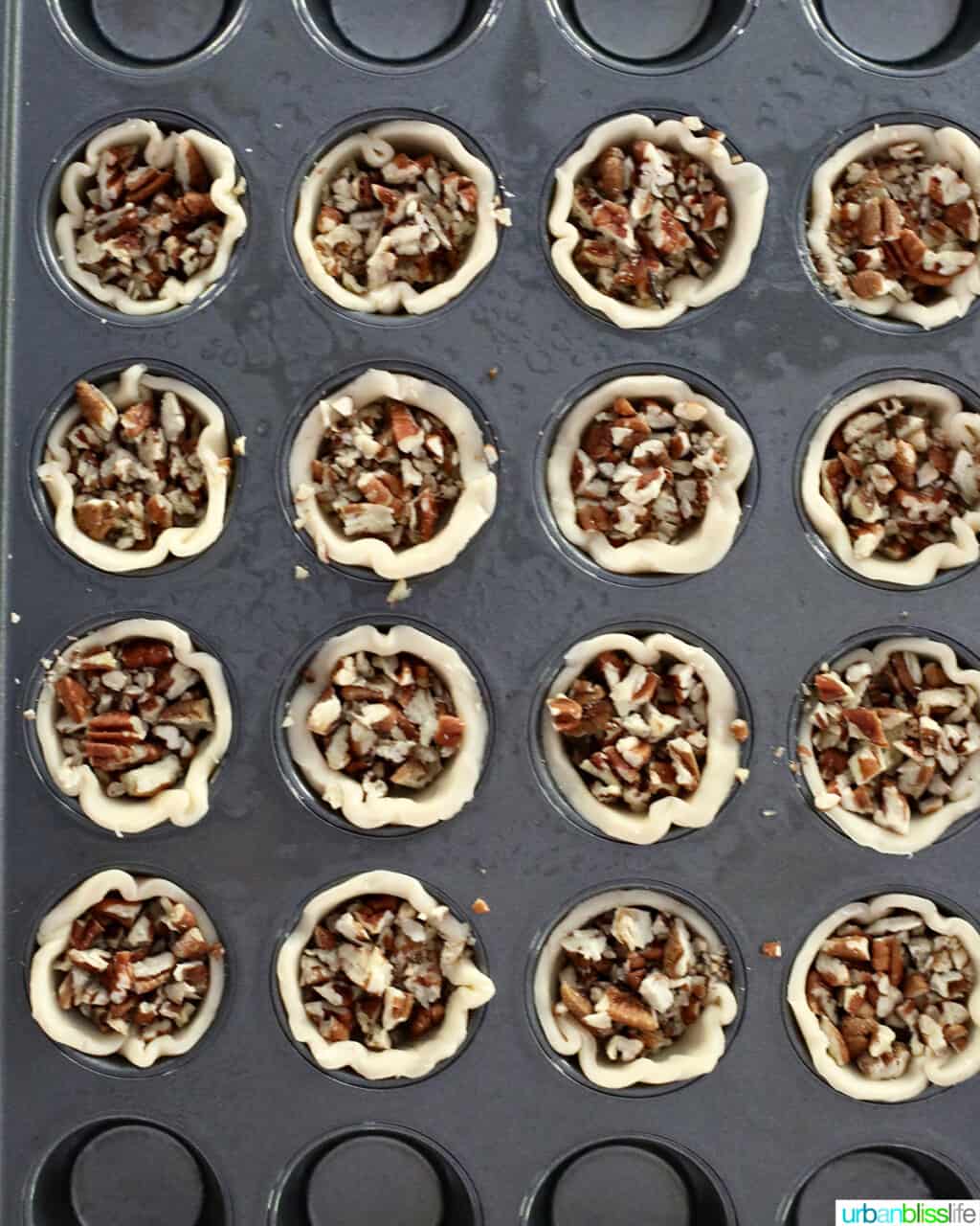 pecans into dough in mini muffin pan