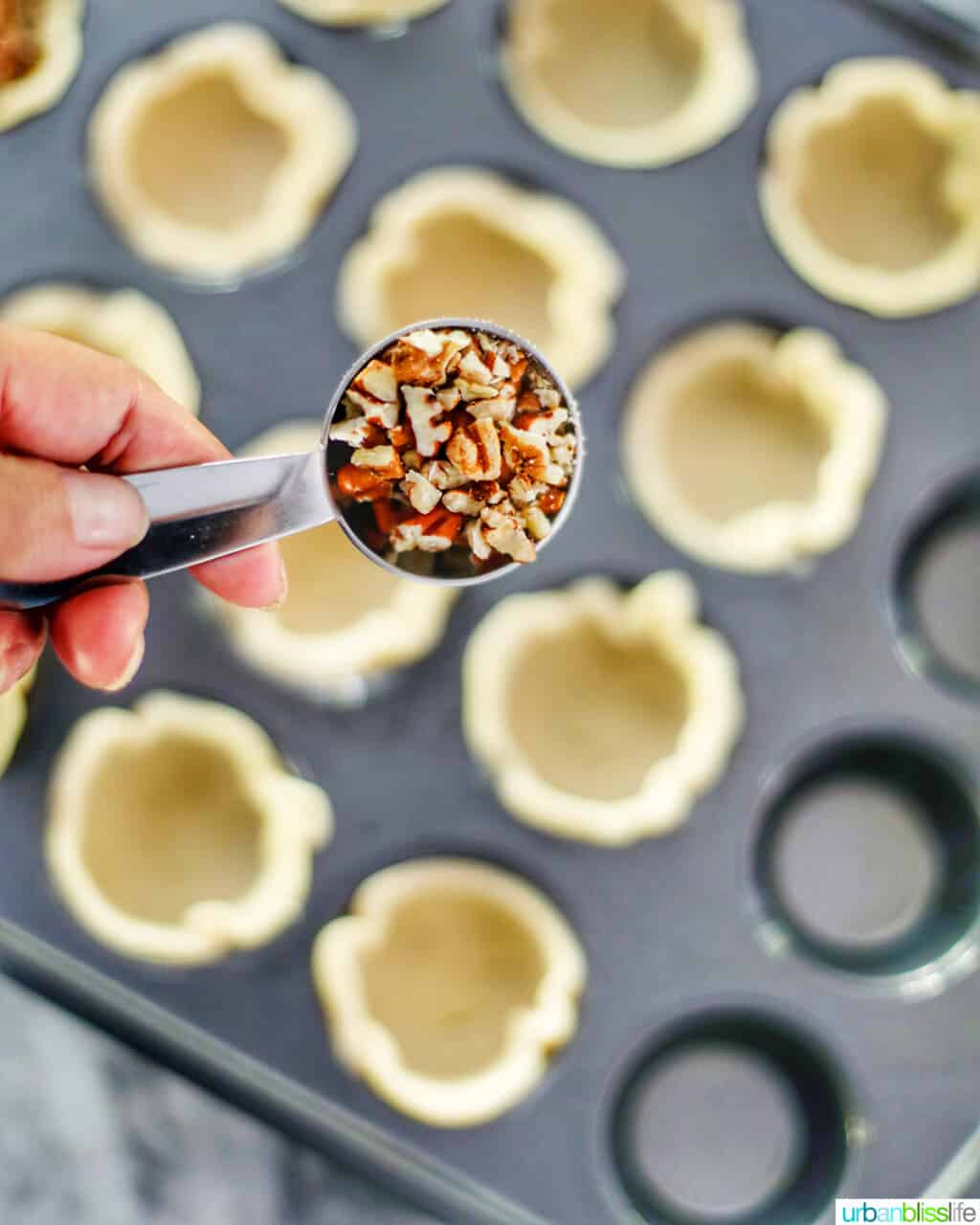 adding pecans into dough