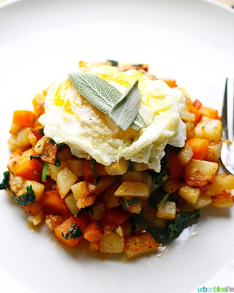 Butternut Squash Hash topped with sage and egg, close up