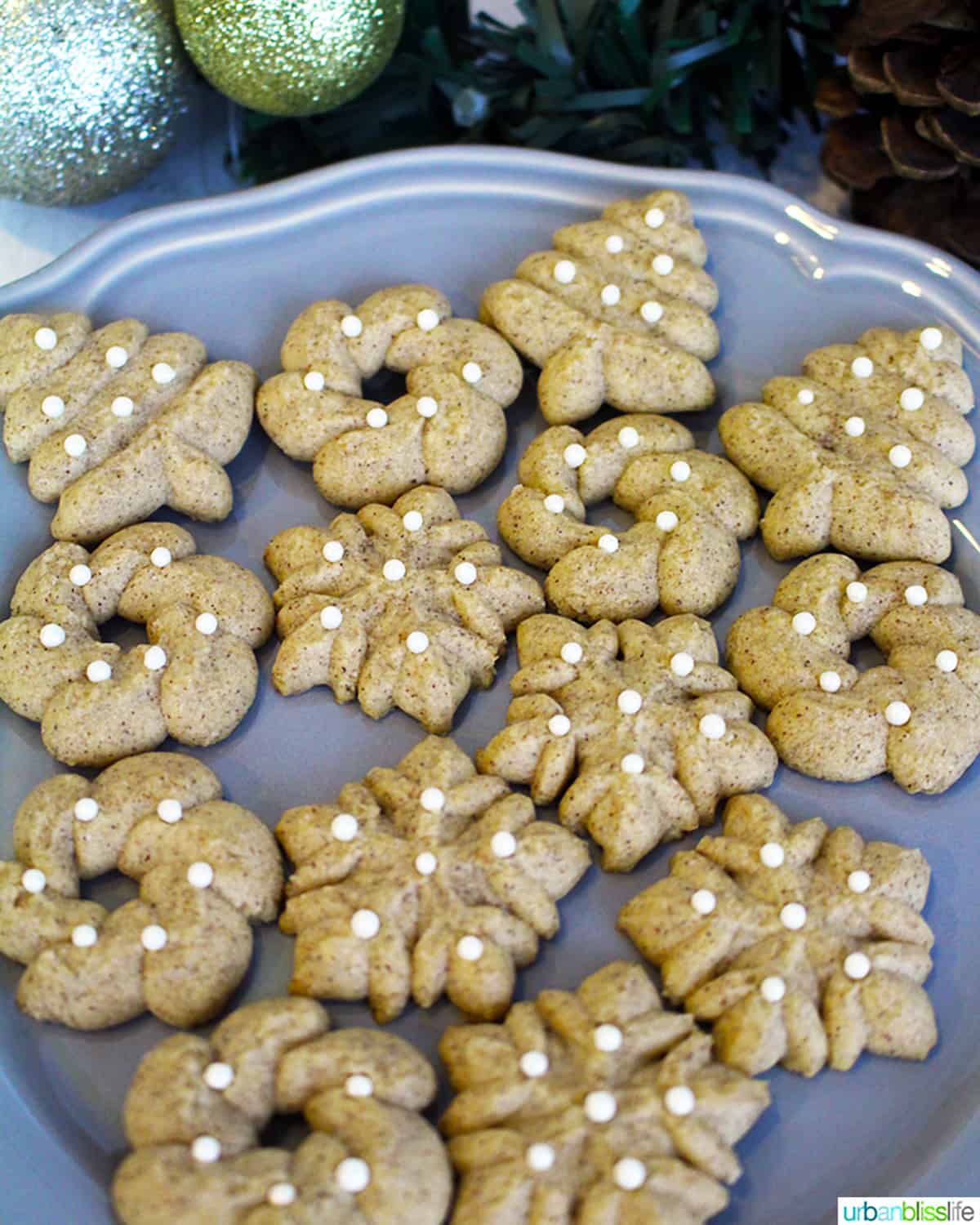 Cinnamon Christmas Spritz Cookies on a plate.