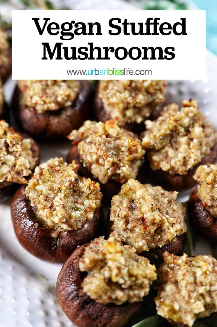 Vegan Stuffed Mushrooms close together on a white plate with title text overlay.