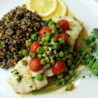 Wild Alaskan Halibut Poached with Tomatoes and Peas Wine Sauce, recipe on UrbanBlissLife.com
