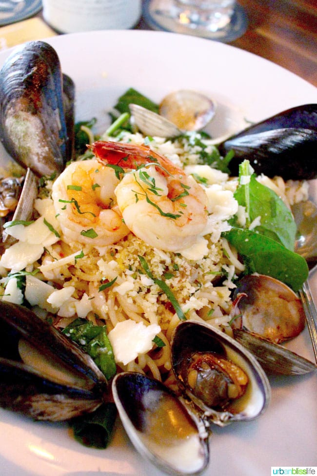 1frutti di mare with shrimp and mussels and pasta in a large bowl at 10 Acres Restaurant in downtown Victoria British Columbia, Canada