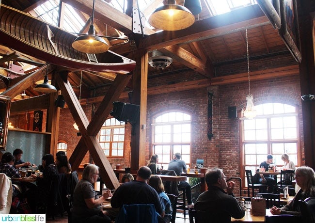 large wide photo of the main dining area of Canoe Brewery in Victoria British Columbia, Canada.