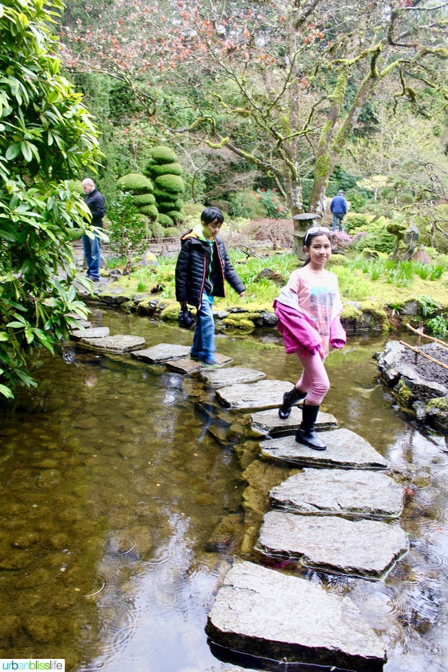 kids crossing pond at Butchart Gardens