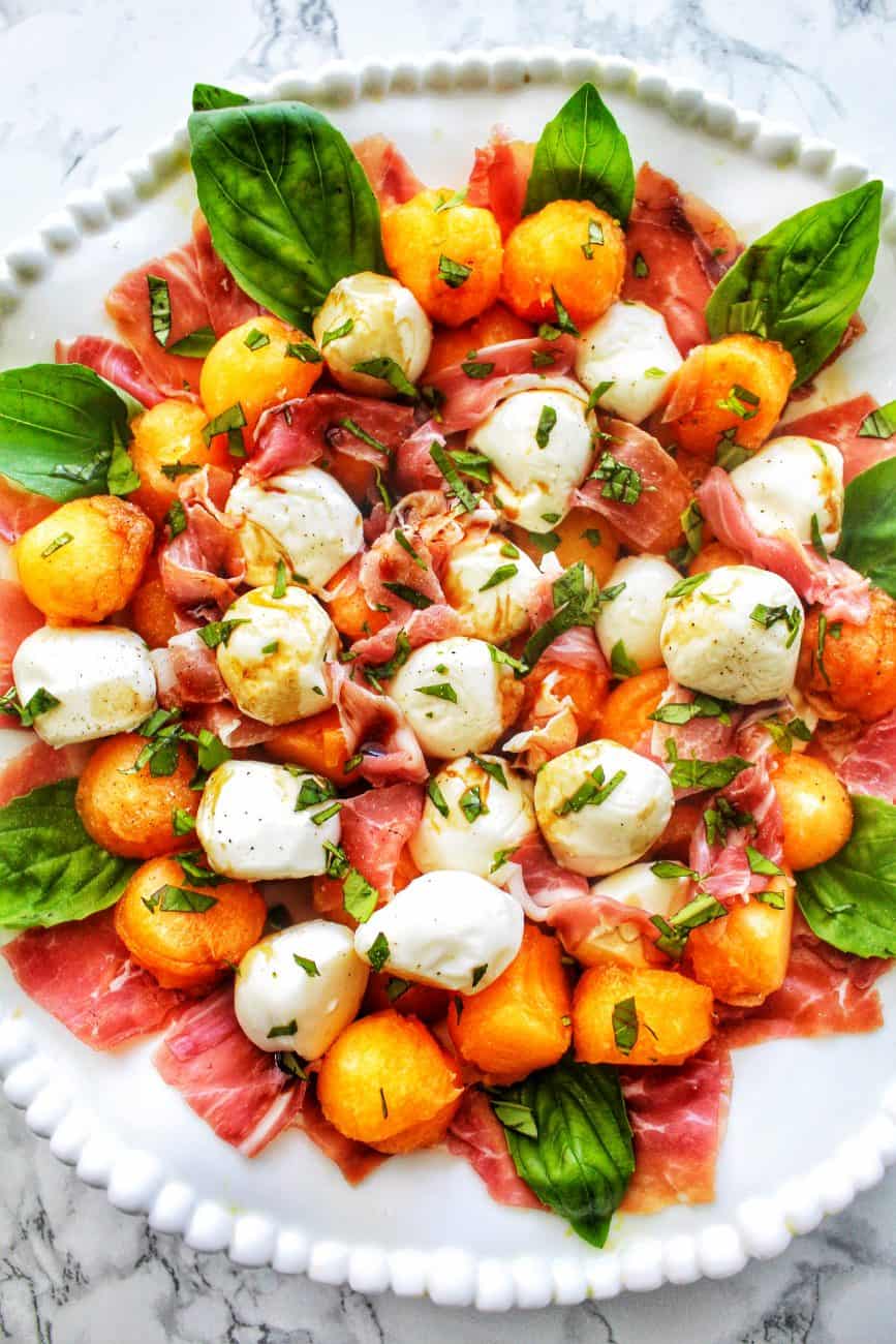 bowl of melon prosciutto caprese salad