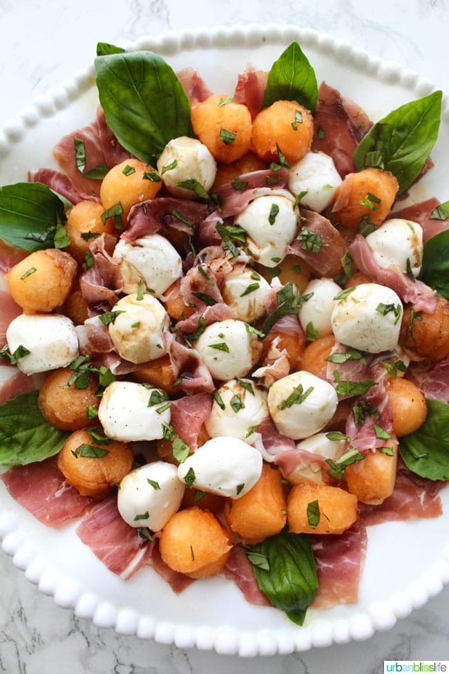 Summer Melon & Prosciutto Caprese Salad is perfect for barbecues and picnics! Recipe on UrbanBlissLife.com
