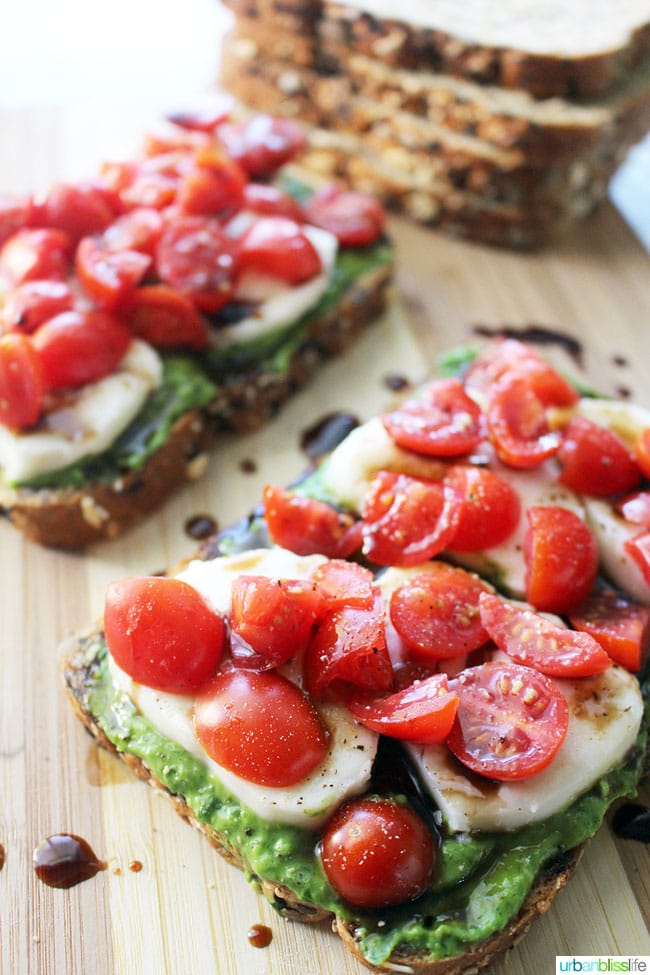 Pesto Caprese Tartines are the perfect open-faced sandwiches to serve for lunch or dinner, or as party appetizers! Recipe on UrbanBlissLife.com