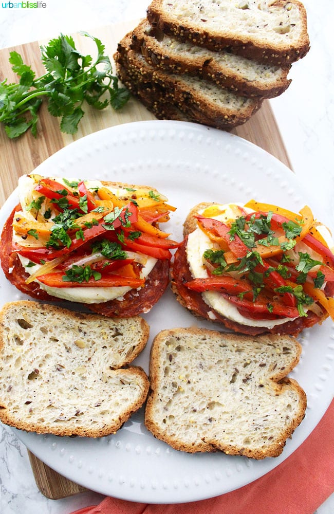 peppers, chorizo, herbs, and cheese on bread slices