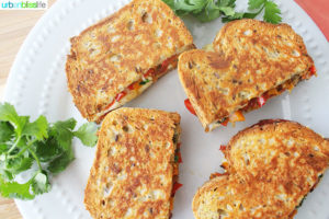 Chorizo Queso Peppers Panini are hearty, delicious sandwiches perfect for lunch, dinner, or to make to feed a crowd for tailgating, holiday parties, and more! Recipe on UrbanBlissLife.com