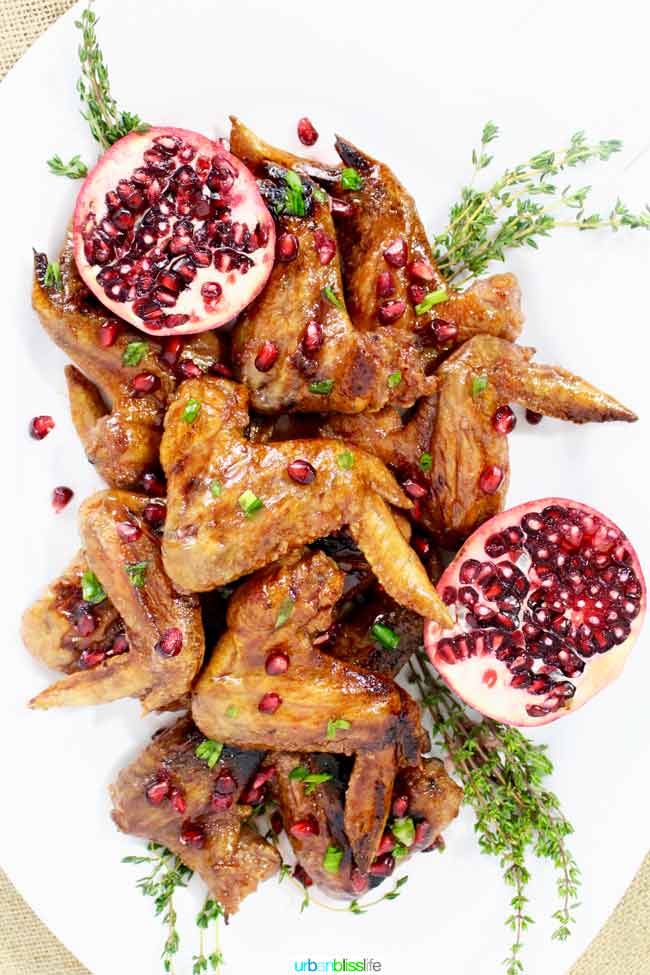 Cranberry Pomegranate Sticky Chicken Wings recipe on http://UrbanBlissLife.com