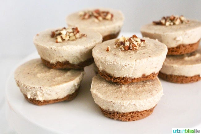 landscape photo of stacked vegan cheesecake bites on a white cake platter.