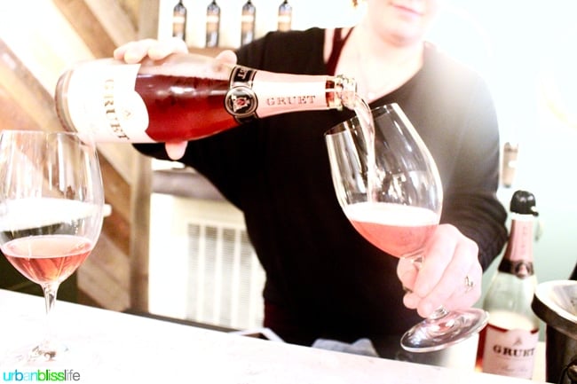 pouring brut rose into a wine glass