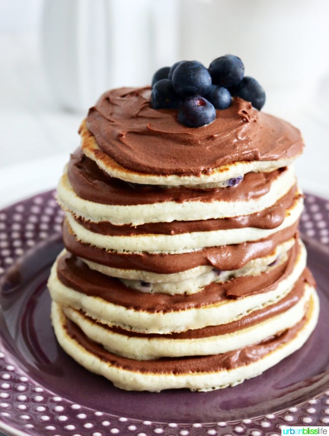 Chocolate Pancake Cake Stacks with Dairy-Free Chocolate Frosting and blueberries