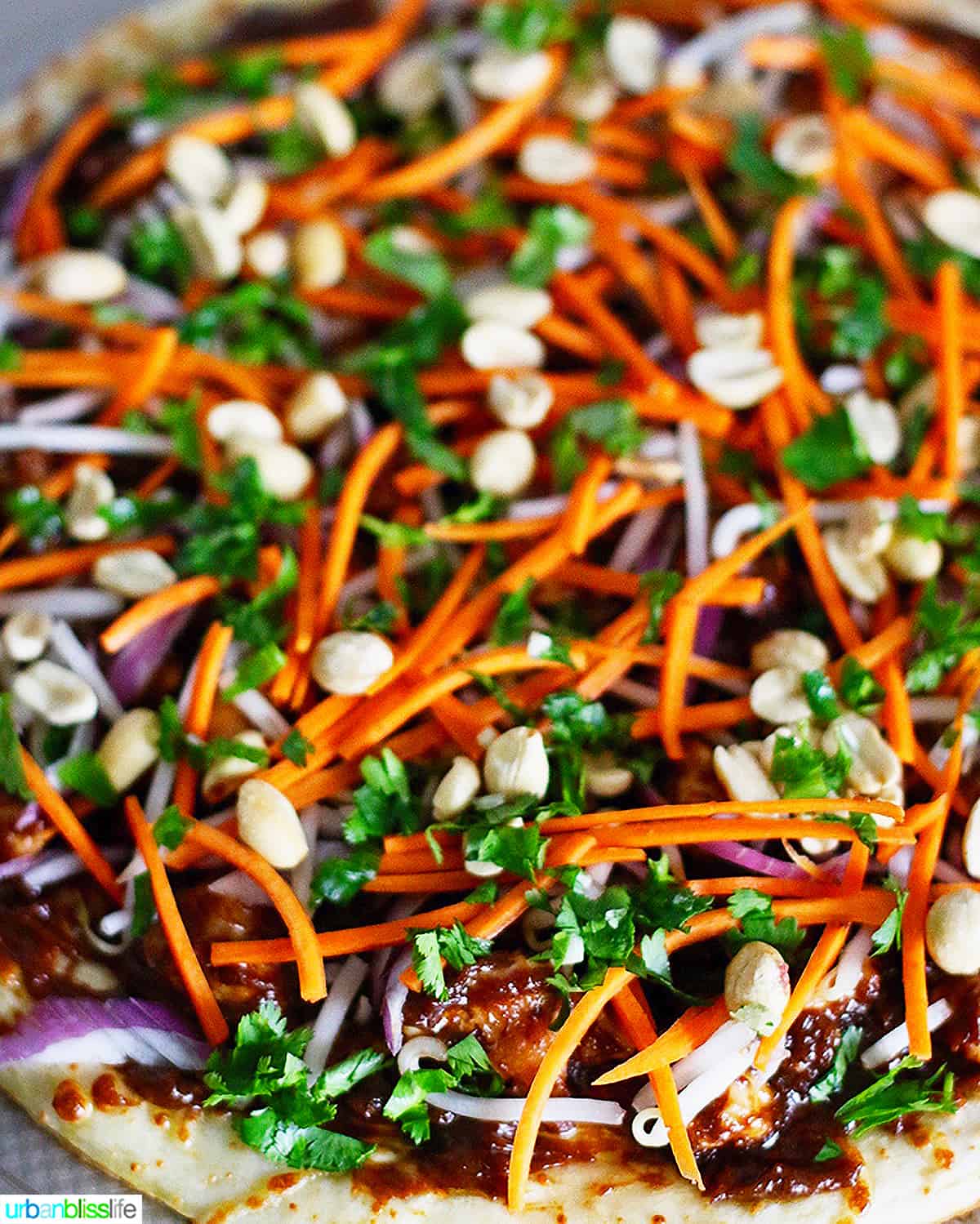 CPK Thai Chicken Pizza with carrots, peanuts, cilantro, chicken.