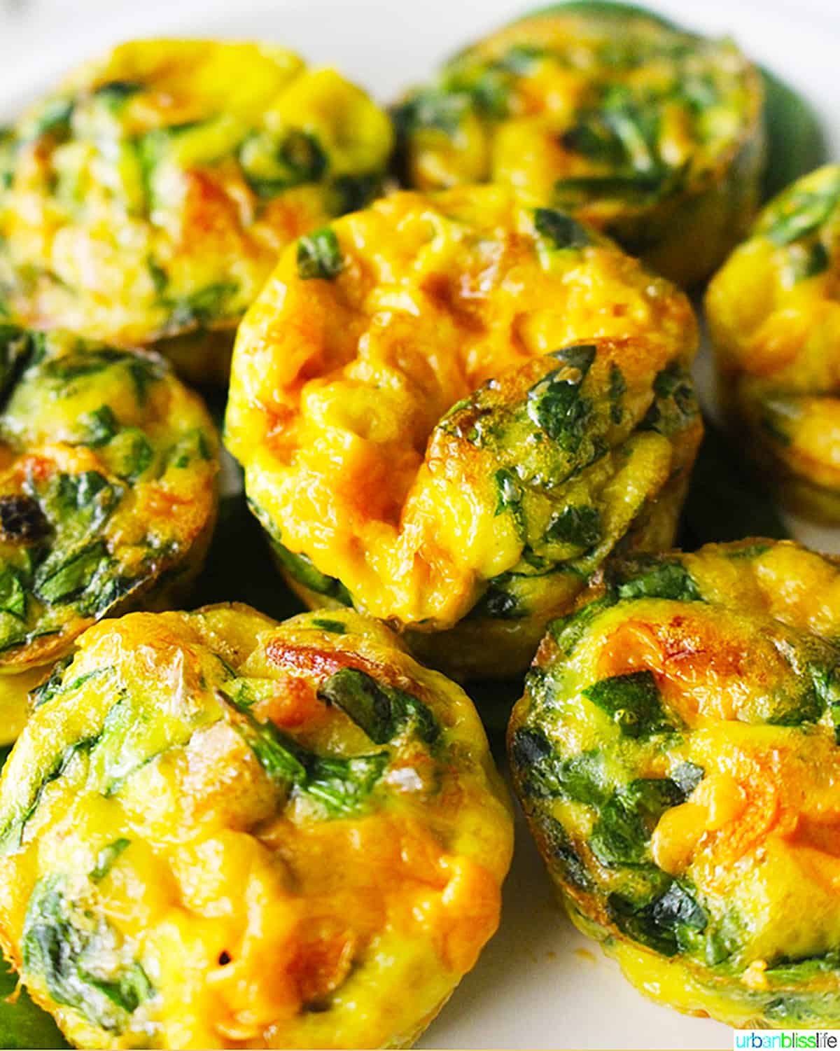 cheese and spinach mini frittatas stacked.