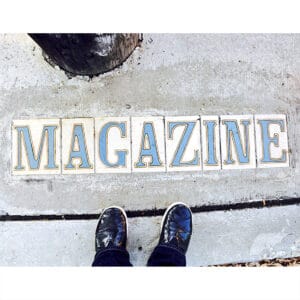 Magazine Street cement with shoes.