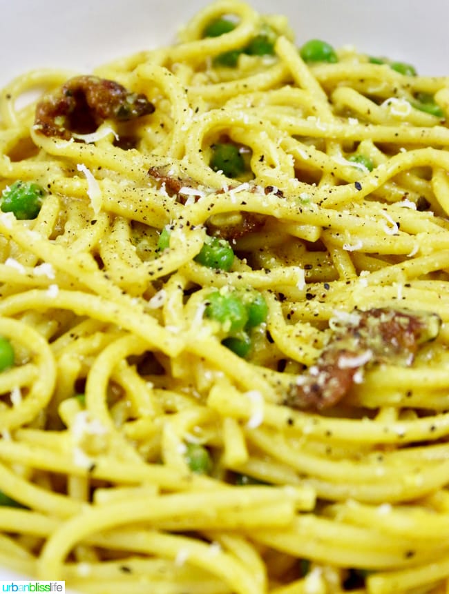 Pasta with Turmeric, Bacon, and Peas is a hearty lunch or dinner dish full of flavor! Recipe on UrbanBlissLife.com