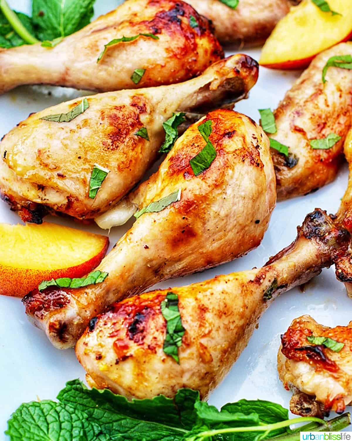 peach bourbon grilled chicken on a white plate.