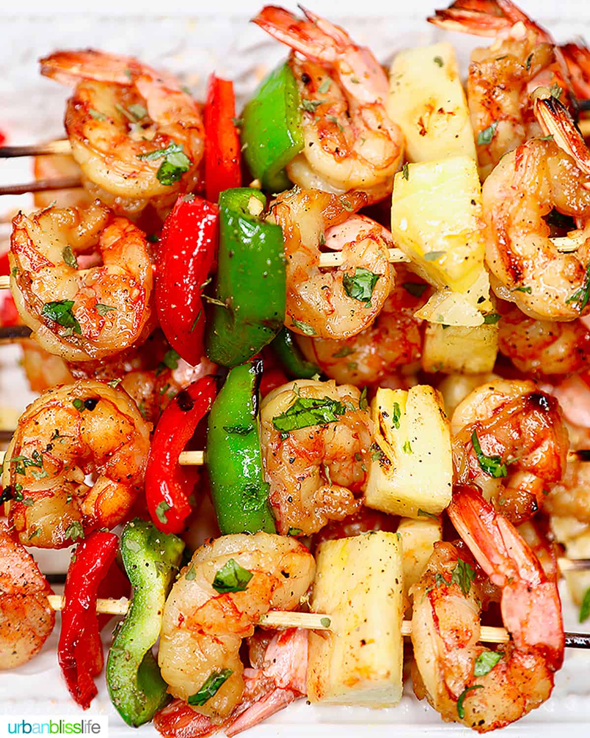 grilled shrimp skewers with pineapple and peppers.