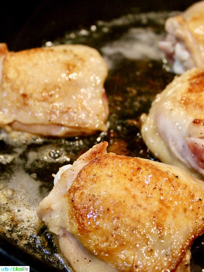 chicken roasting in pan