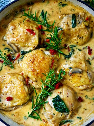 pan with dairy free marry me chicken thighs in a rich mushroom sun-dried tomato sauce.