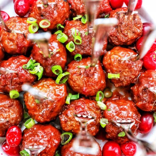 cranberry meatballs with green onion garnish.