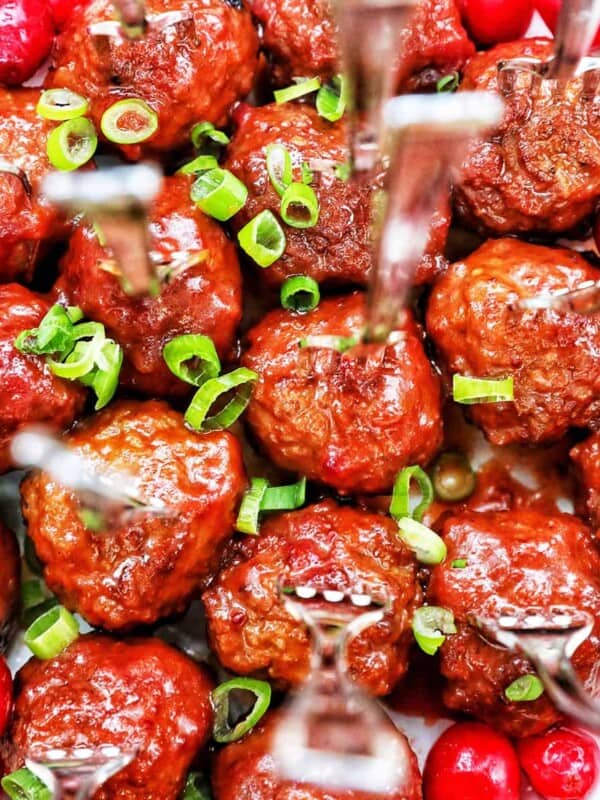 cranberry meatballs with green onion garnish.