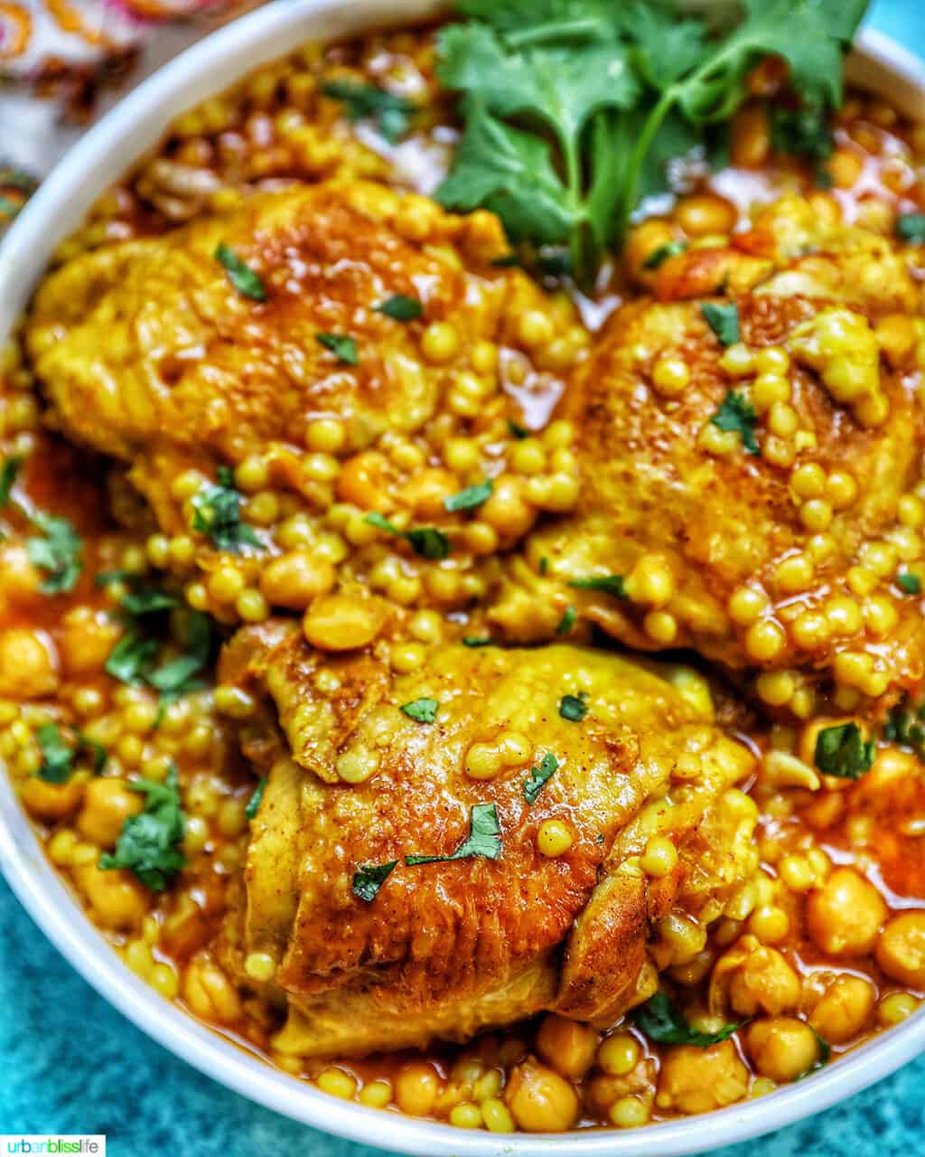 colorful picture of Instant Pot Moroccan Chicken in a large serving bowl