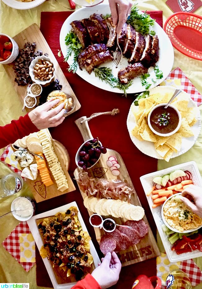 table full of tailgating game day food and drinks