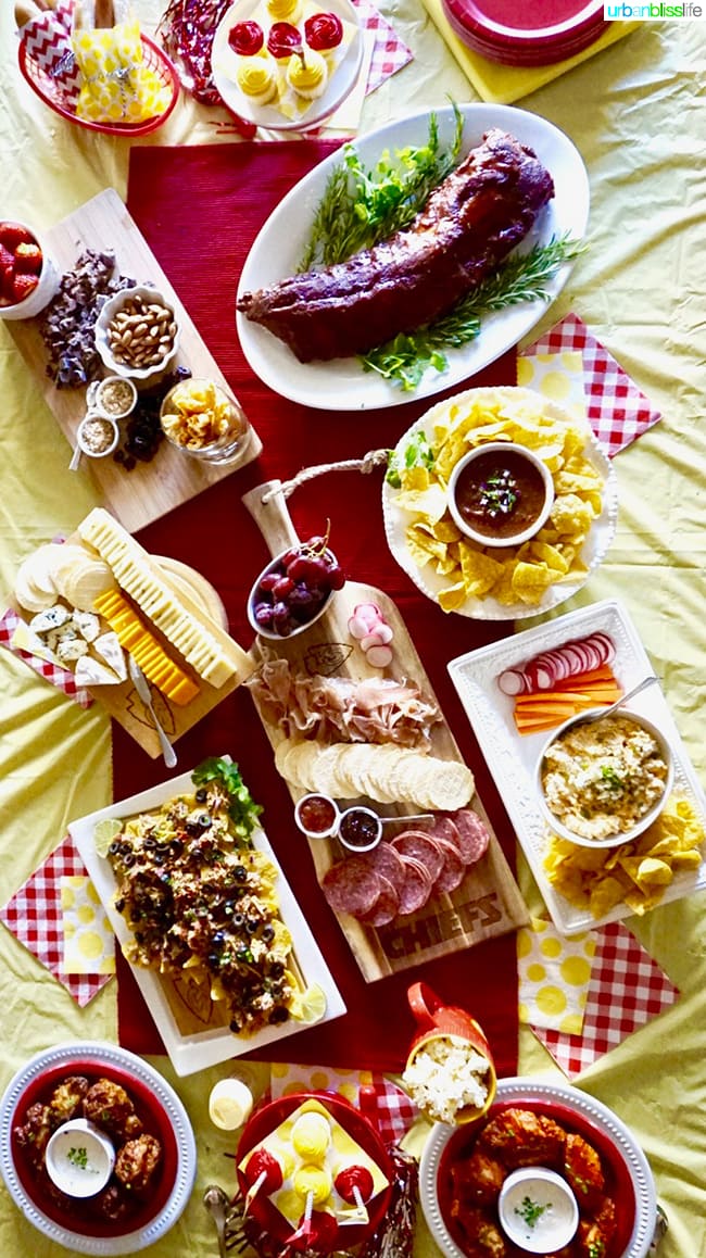 table full of tailgating game day food and drinks