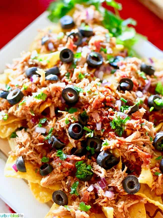 Slow Cooker Pulled Pork Nachos recipe on UrbanBlissLife.com