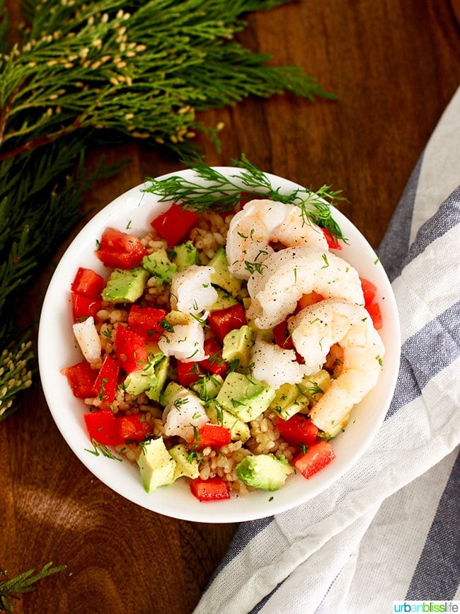 Gluten free dairy free recipes - shrimp avocado rice bowl with napkin and leaves