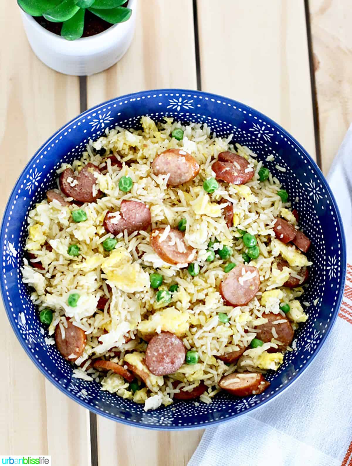 fried rice with sausage in blue bowl