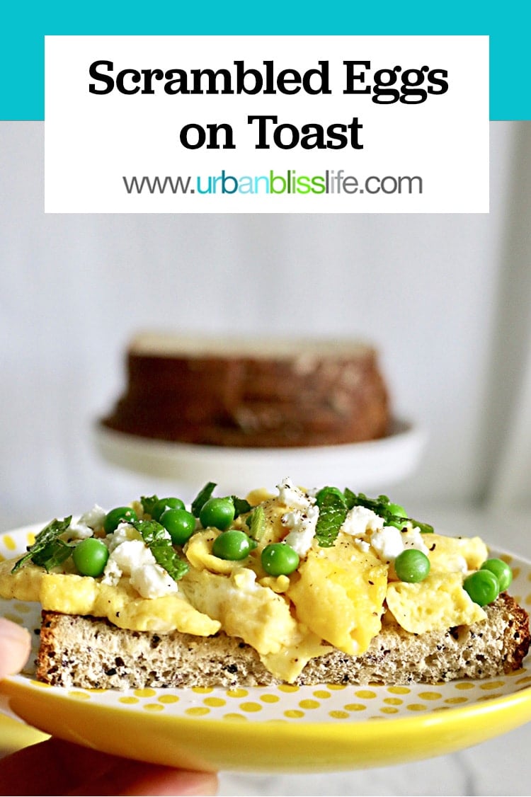 Scrambled eggs on toast with peas and feta