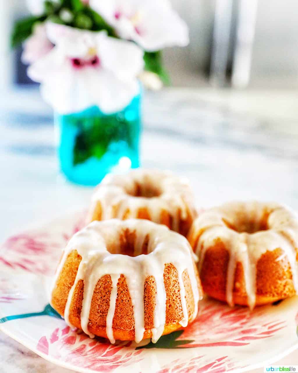 straight-on angle of three mini bundt cakes with citrus