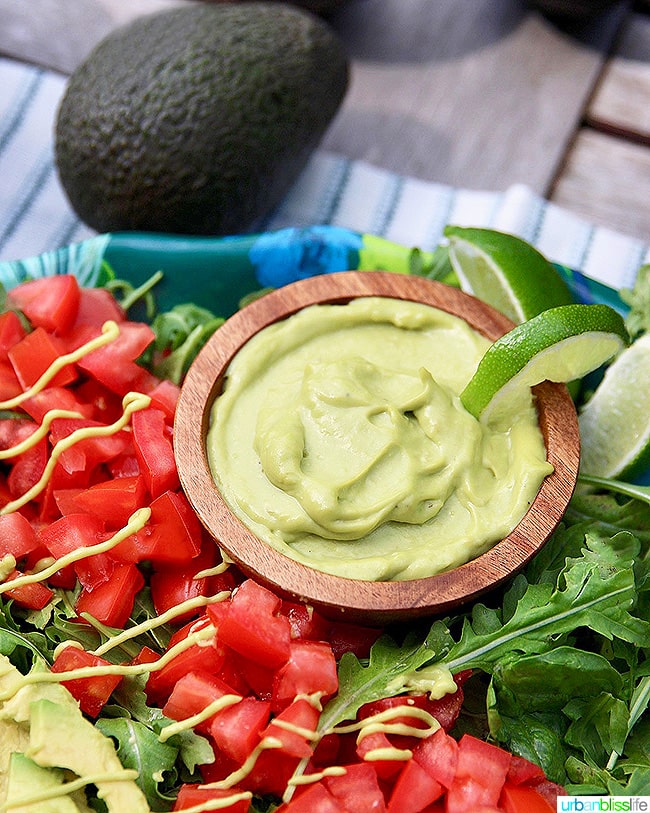 Creamy avocado lime dressing with chopped tomatoes