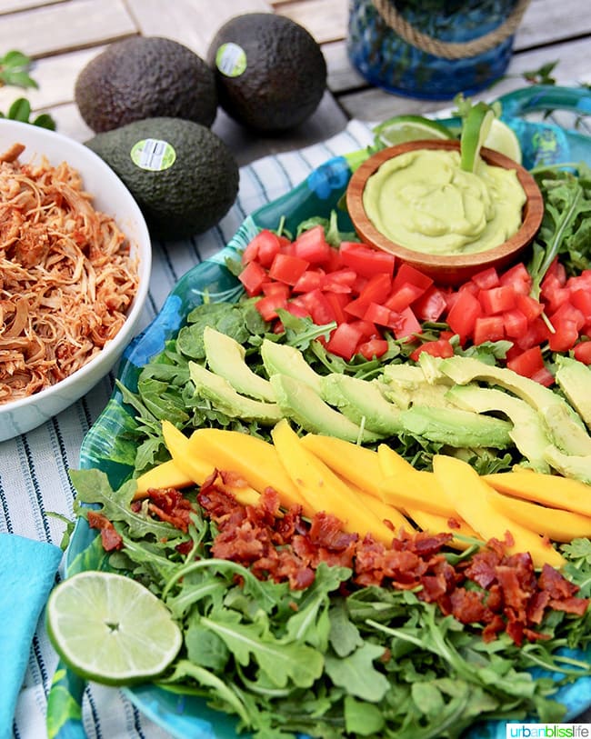 Creamy Avocado Lime Dressing & Dip with mangos, tomatoes, and bacon