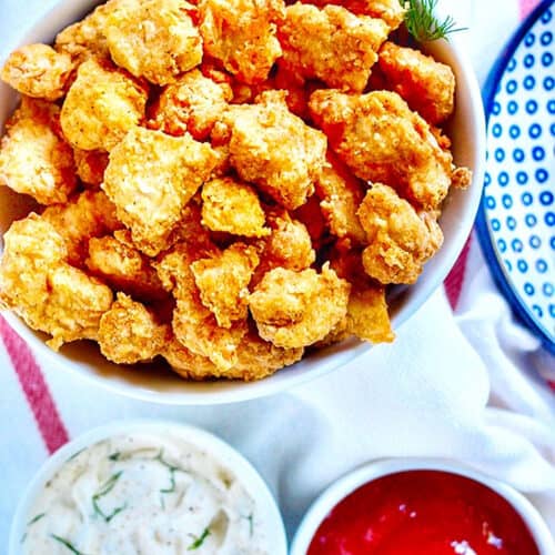 Air Fryer Popcorn Chicken with two dipping sauces.