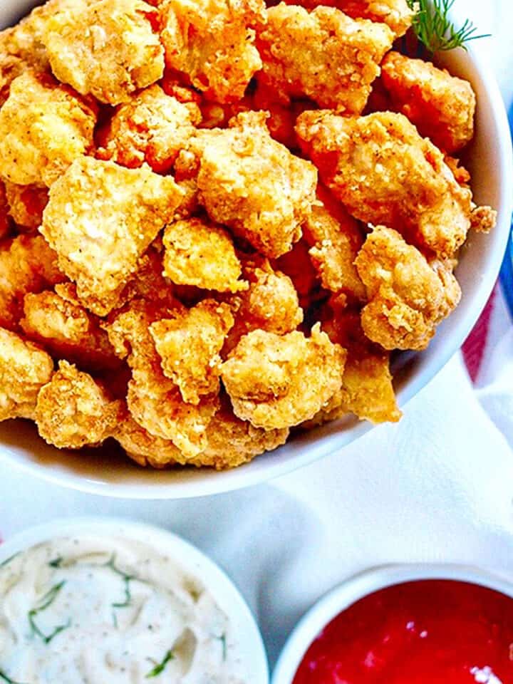Air Fryer Popcorn Chicken with two dipping sauces.