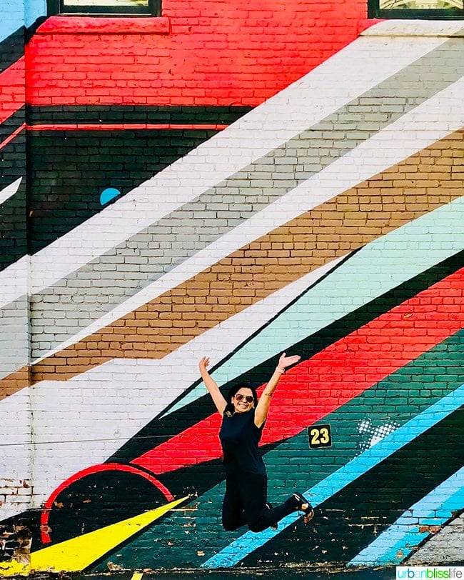 Marlynn Schotland jump shot in Denver, Colorado colorful mural