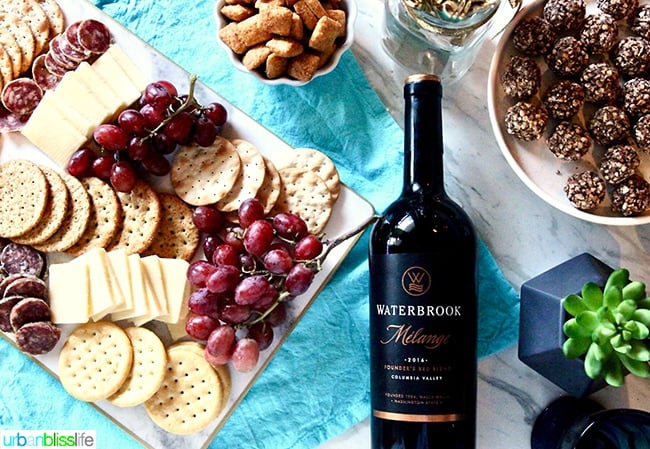 holiday party table with wine and cheese