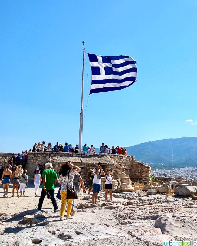 Greek flag flying at the top of the Acropolis