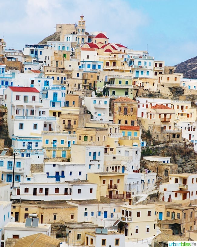 hillside stacked with houses and churches of Olympos village, on Karpathos Island, Greece.
