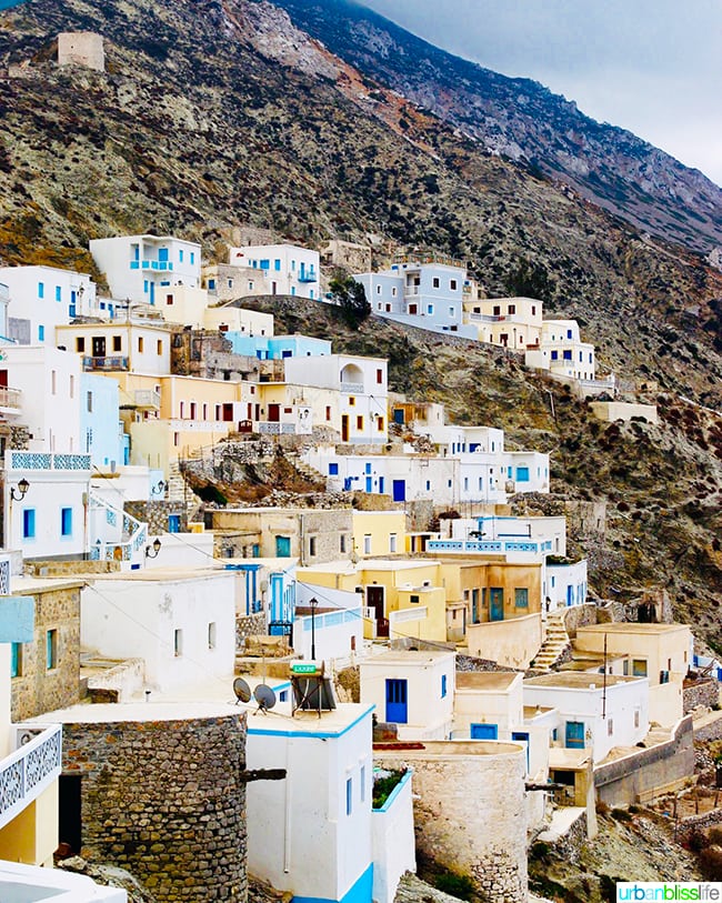 hillside stacked with houses and churches of Olympos village, on Karpathos Island, Greece.